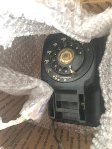 a picture of a Stromberg Carlson 500 telephone being unpacked
