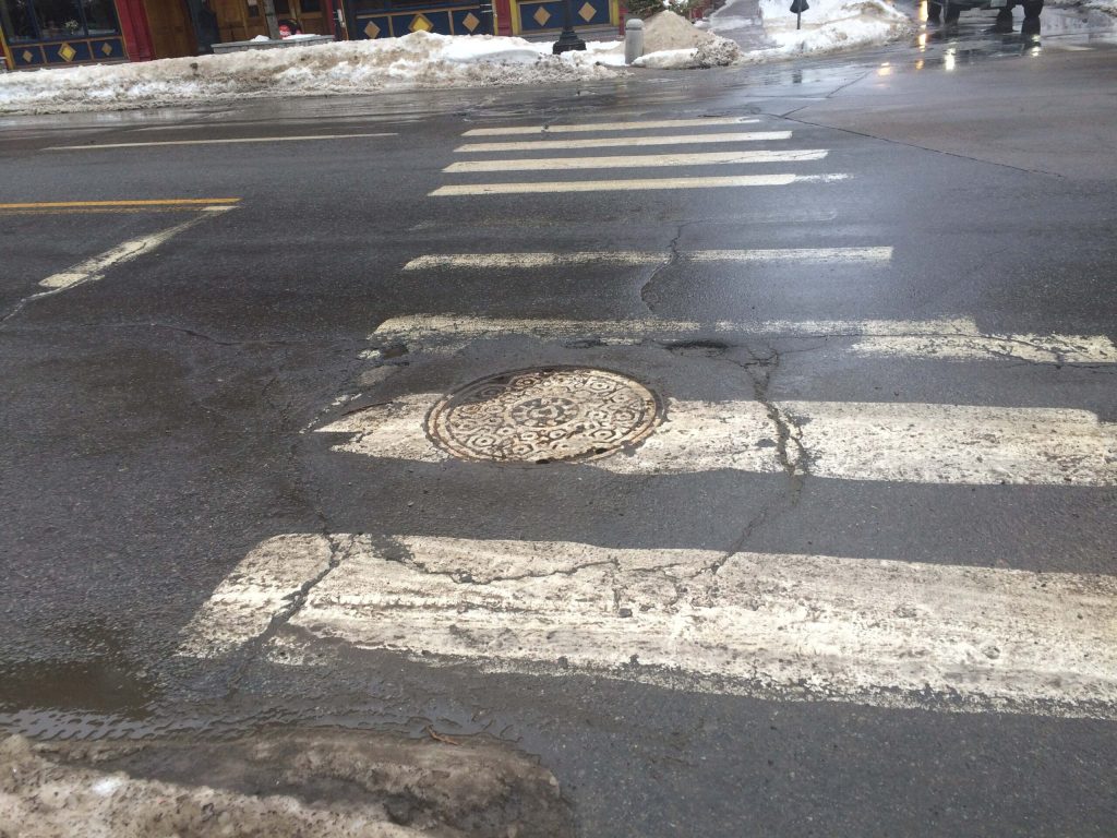 a picture of a manhole cover in Manchester, New Hampshire on Elm Street